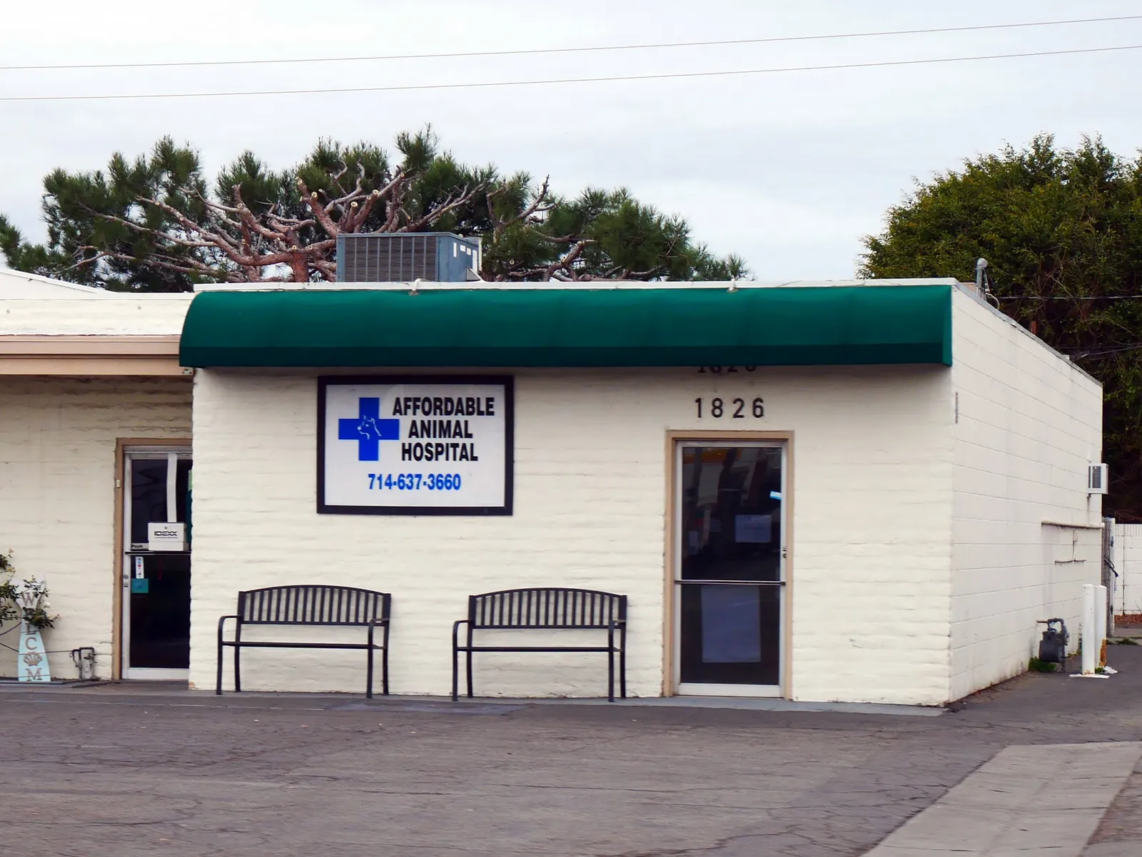 Front exterior of Affordable Animal Hospital Orange clinic with the blue cross welcome sign